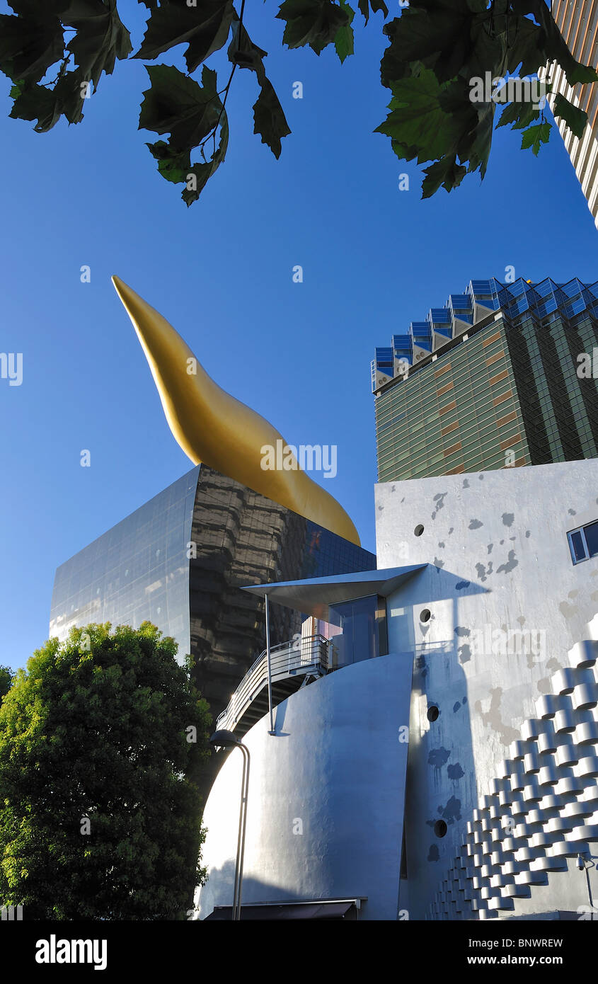 Low angle shot of the 'flamme d`or' (designed by Philippe Starck) on top of the Asahi Beer Hall in Tokyo`s Asakusa area (Japan) Stock Photo